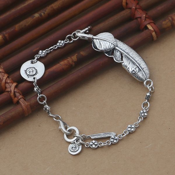 

Brand new 925 Sterling silver charm bracelet-stamped charm and huge feather charm with smaller feather style with link chain bracelet