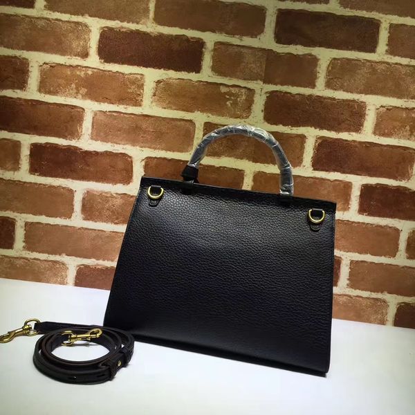 

the famous fashion brand leather female handbag logo letters are decorated with lapel shoulder bag
