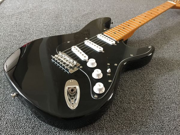 

electric guitar black yellowish maple fingerboard chrome parts