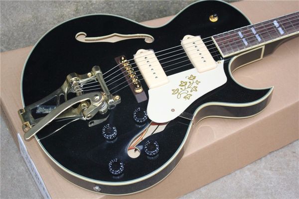 

Factory cu tom hollow body black electric guitar with golden hardware tremolo y tem p90 pickup can be cu tomized
