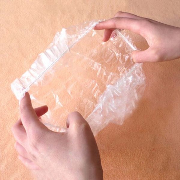 

100pcs one-off disposable l shower bathing clear hair elastic caps hats shower caps p101