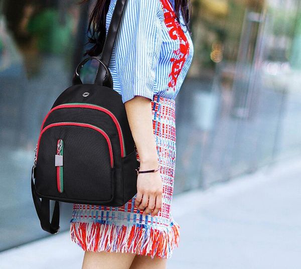 

female bag. backpack. little knapsack. casual fashion woman bags. nylon cloth. shell bag. book bag. handbag. backpack style. small