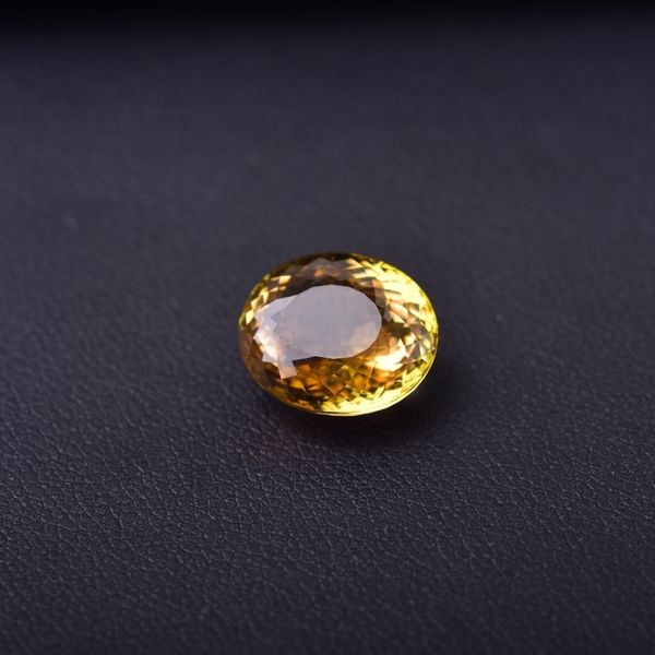

7.04ct tourmaline yellow gemstones .the wish stone of power and status. specifications: 12.6mm * 10.5mm * 7.1mm, Black