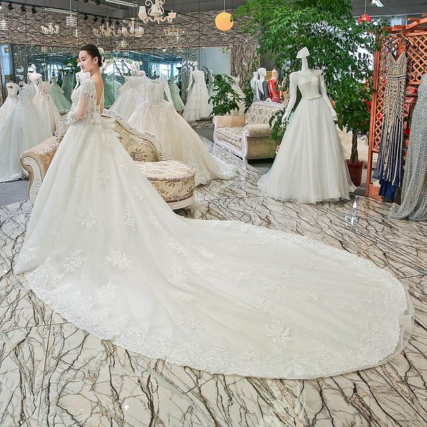 

2019 latest bohemian wedding dresses tassel tulle sleeve illusion neckline backless lace up back hand made 3d floral applique wedding gowns, White