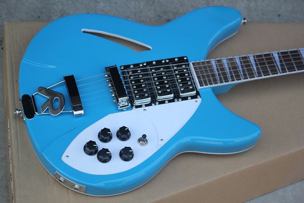 

Semi hollow light blue electric guitar with 6 tring r tailpiece white pearl fret inlay chrome hardware 3 pickup 5 knob