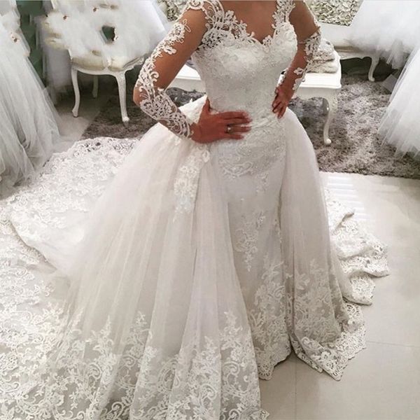 Abiti da sposa a maniche lunghe con illusione di pizzo nigeriano Sirena con strascico staccabile Abito da sposa con scollo trasparente con applicazioni di perline e schiena cava