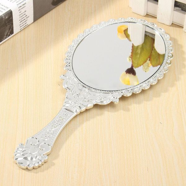 

ladies vintage repousse floral hand held oval mirror makeup dresser