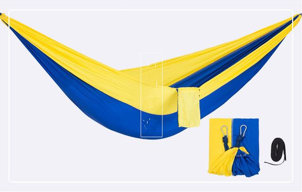 

two people green parachutes hammock campings hammocks double the hammock leisure travelers man