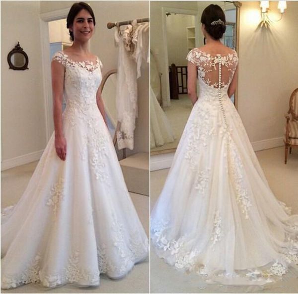 

2020 modest new lace appliques wedding dresses a line sheer bateau neckline see through button back bridal gown cap sleeves, White