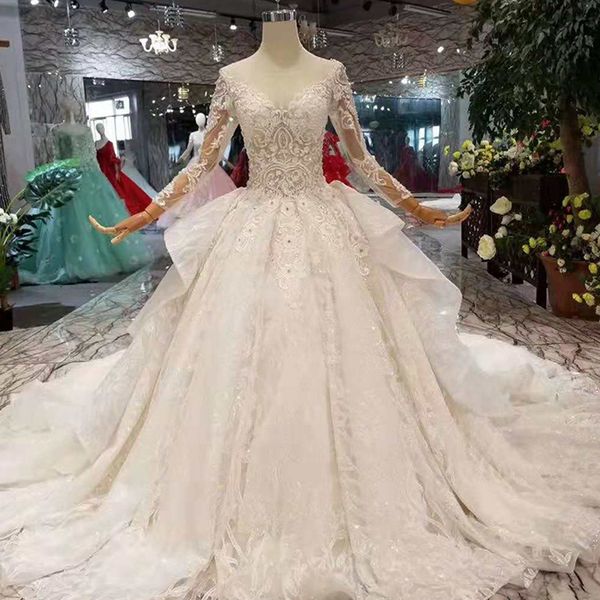 

2019 design wedding dresses illusion big o-neck long tulle sleeve luxury applique big bow wedding gown with shiny train, White