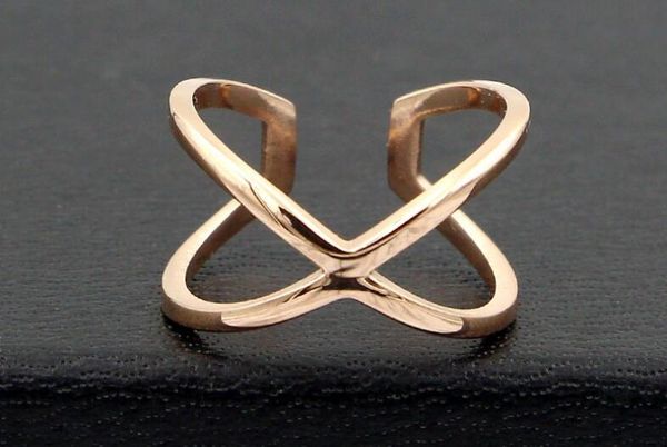 

new korean version of the hollow cross x word fashion finger ring ring joker titanium steel plated rose gold ring, Golden;silver