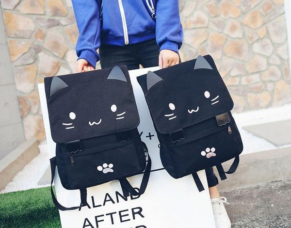 

high-capacity. children's bags. cute cartoon double shoulder bag. knapsack. black canvas bag. cartoon cat. magic stickers. backpack