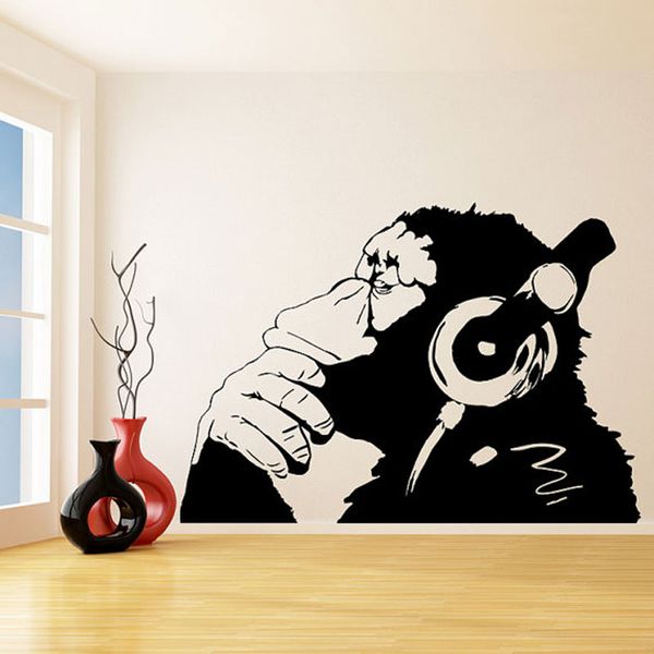 

banksy wall decal monkey with headphones / one color chimp listening to music in earphones / street graffiti sticker