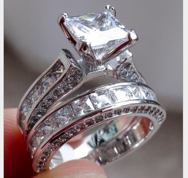 

a zircon wedding ring with a pair of diamond inserts, Silver