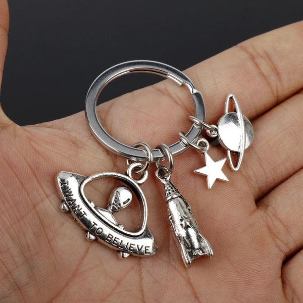 

yamily 12pcs/lot space alien key ring i want to believe alien ufo spaceship keychain pendant charm jewelry gift for men women, Silver
