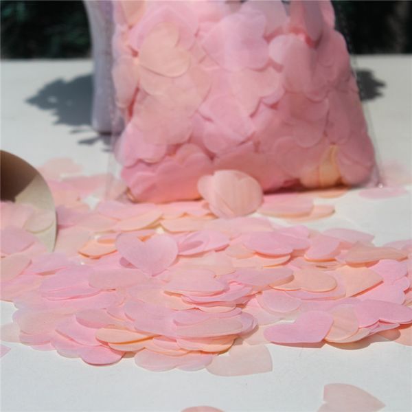 

peach blush pink biodegradable hearts tissue paper petals engagement table decor confetti wedding guestl throwing confetti