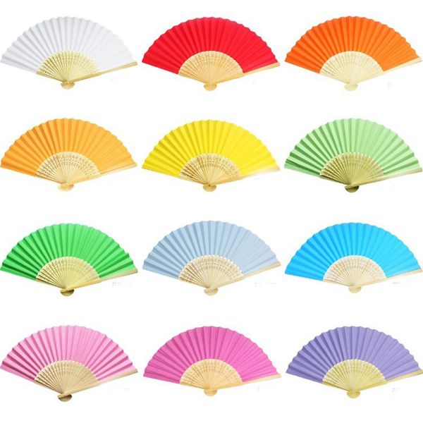 white hand held fans