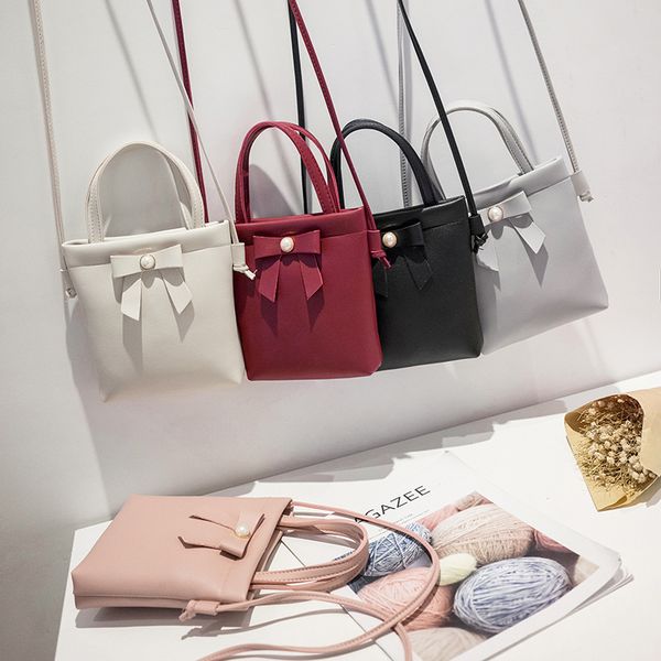 

kids girls mini bags backpacks woman one-shoulder versatile simple trend packet wallet cosmetic bag bow decoration 2346