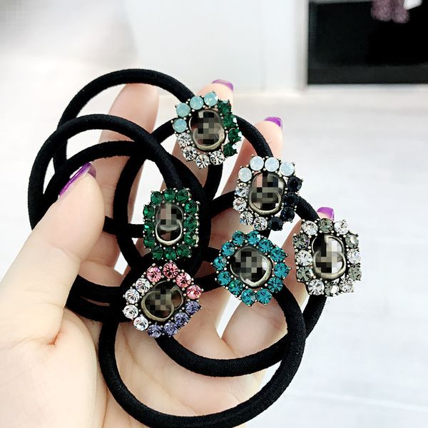 

Металлическая веревочка волос хвостика Диаманта письма кристаллическая, модная