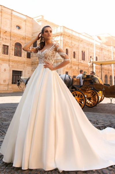 Nuovo arrivo Abiti da sposa country Appliques in pizzo Maniche 1/2 Sheer Neck Abito da sposa Abiti da sposa Corte dei treni Vestidos De Noiva