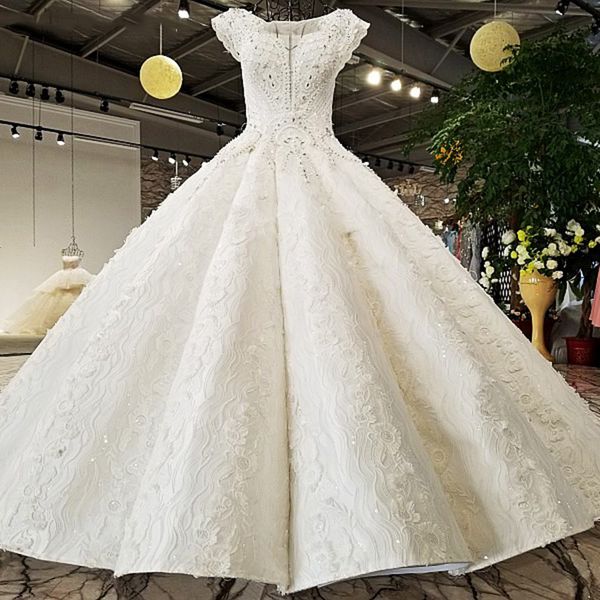 

2019 lebanon sleeveless wedding dresses illusion deep v neck hollow back shining crystal sequins hand made pattern applique bridal gowns, White