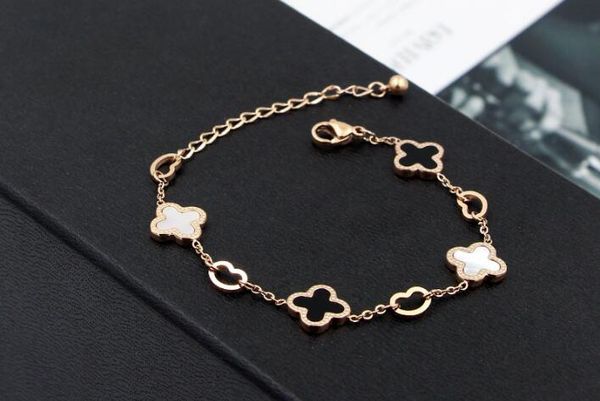 

korean version of the new hollow heart black and white color bell lucky grass titanium steel plated rose gold bracelet