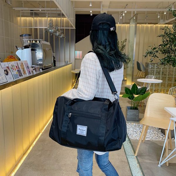 

2020 new travel bag female portable fitness luggage storage bag luggage