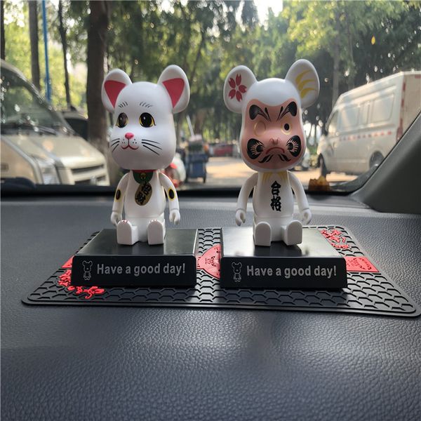 

new face-changing building block bear car parking phone number shaking head doll car central control decorative hand decoration