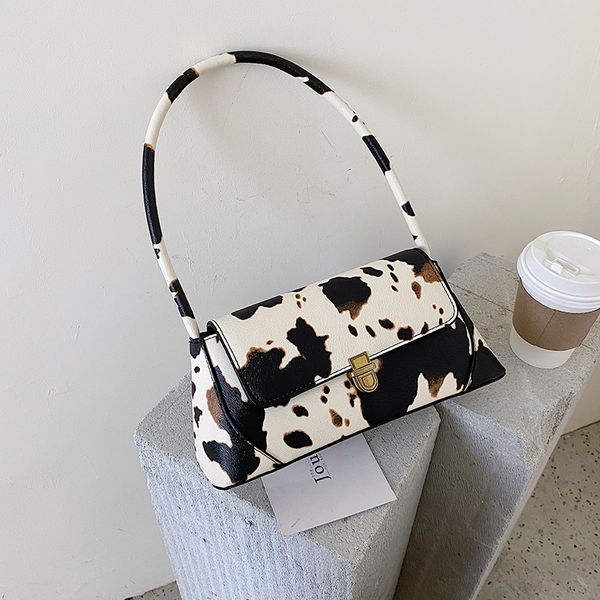 

fantasy 2020 new special design cow pattern spotted handbags for women black and white color shoulder bags saddle bag armpit bag