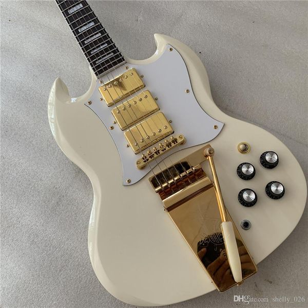 

white electric guitar, gold accessories