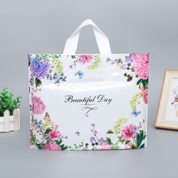 Sacchetti di plastica per borsa con stampa bella giornata con manici Vestiti colorati per farfalle di fiori che confezionano borse con manico per boutique