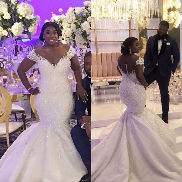 

2020 african plus size mermaid wedding dresses off shoulder lace appliques beaded sheer button back court train bridal gowns, White