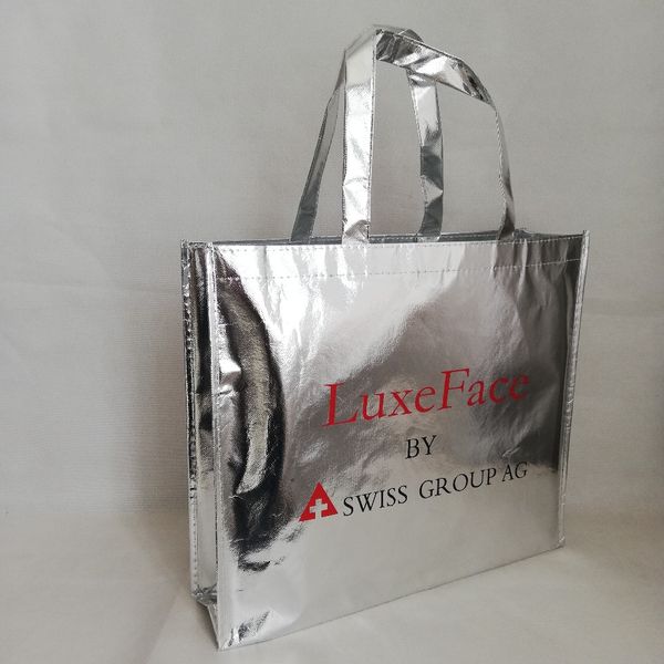 

whalesales 500pcs/lot shiny silver metallic laser shopping tote bag stylish non woven custom bags for fair trade show exhibition