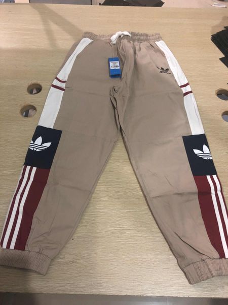 

мода марка брюки для мужчин трек брюки бегунов с рекламными буквами мужчины тренировочные брюки шнурок бегунов мужчины женщины брюки оптом, Black