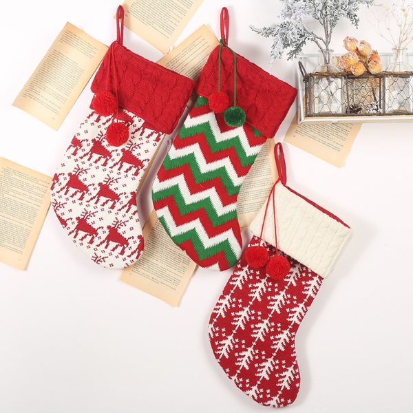 

knitted christmas stockings gift holders with two pom-poms xmas tree fireplace hanging ornaments seasonal decorations