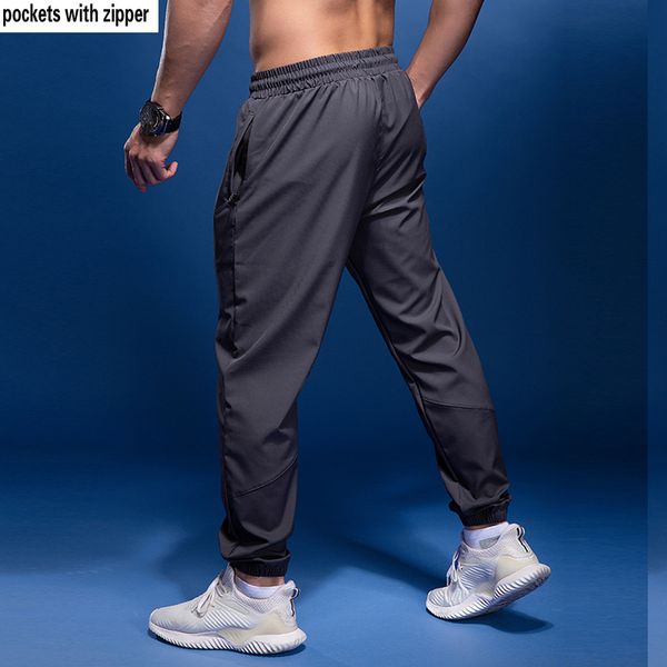 

bintuoshi new sport pants men running pants with zipper pockets soccer training joggings men fitness for 1, Black;blue