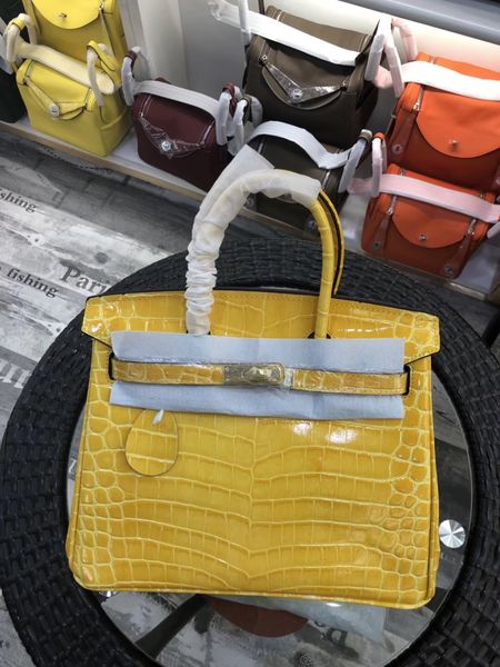 

De igner new color yellow lady tote houlder bag with lock luxury women lady cowhide alligator genuine leather fa hion handbag whole ale