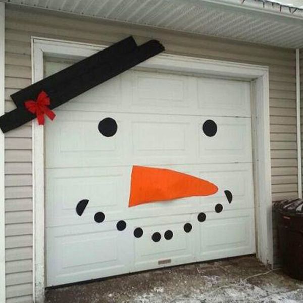

diy christmas snowman expression decoration for garage door doorway