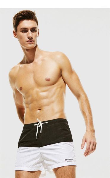 

мужские пляжные шорты щитовые цвета конструктора mens shorts мода quick dry упругие талии шорты мужская одежда повседневная, White;black