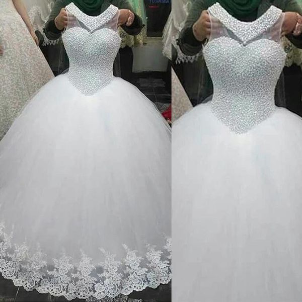 

exquisite tulle jewel neckline ball gown wedding dresses pearls beading sleeveslss crystals bridal gowns with lace applique, White