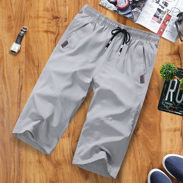 

men's shorts summer pants casual beach shorts sports loose and plus-sized quick drying pants fashion men's middle 5, White;black
