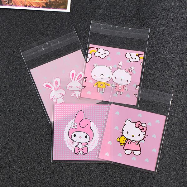 

500pcs cute cartoon pink cookie cellophane bags birthday plastic biscuit bags candy packing self adhesive opp bag 7x7cm