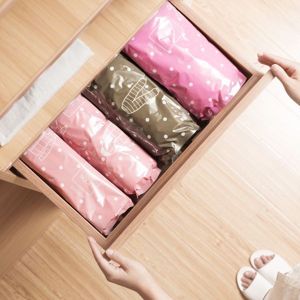 

compress waterproof clothing and other articles of daily use clothes arrangement vacuum down jackets travel accept bag