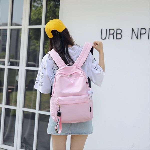 

2020 new college style outdoor backpack simple fashion solid color pendant backpack