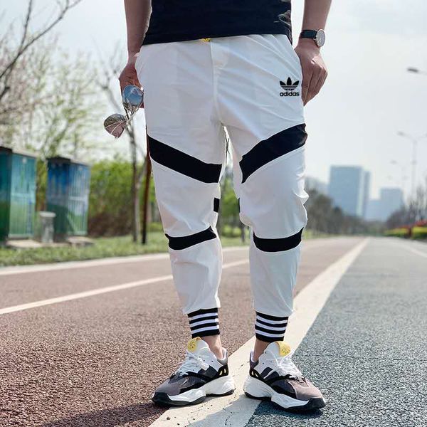 

Новые мужские брюки Мода Беговая штаны женщин молнии Комбинезоны Beam Foot Брюки Нерегулярные бегуны Брюки мужские Joggers A-9070