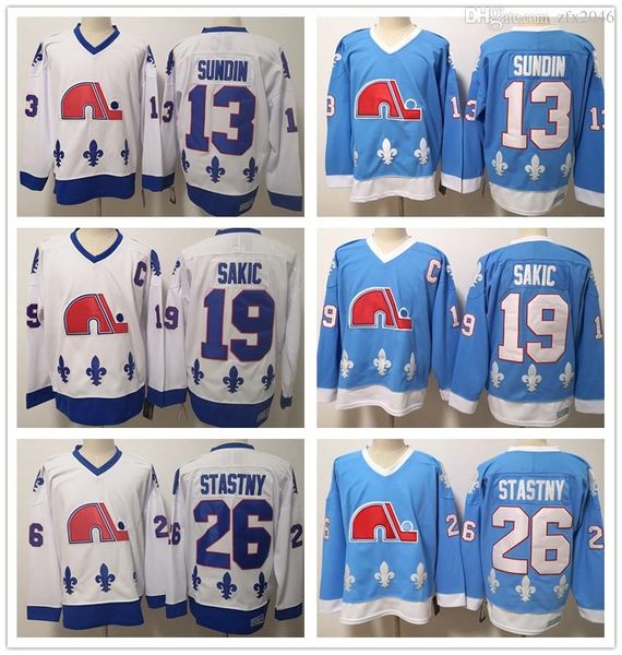

Men Quebec Nordiques 13 Mats Sundin 19 Joe Sakic 26 Peter Stastny CCM Blue Wite Hockey Jerseys Ice Shirts Stitched Logos embroidered