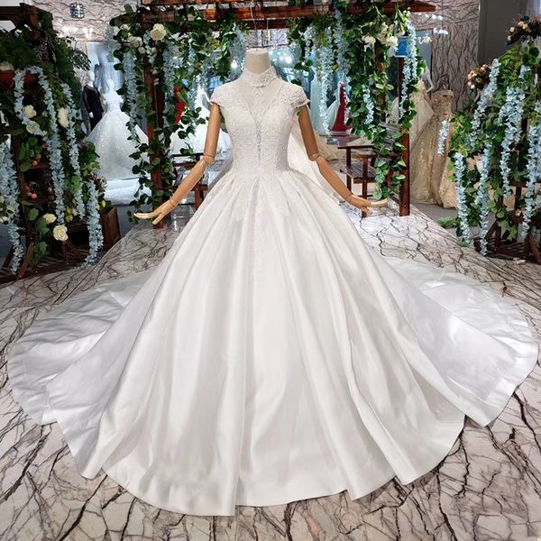 

2019 latest bohemian wedding dresses cap sleeve high neck lace up back illusion neckline pearl handmade applique pattern bridal gowns garden, White