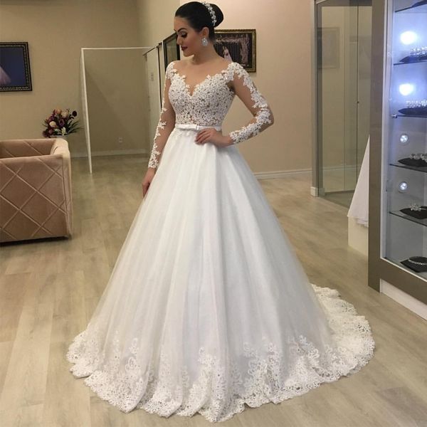 Abiti da sposa trasparenti alla moda sul retro Abiti con scollo tondo Appliques Cintura con papillon Perle Abito da sposa Sweep Train robe de mariee