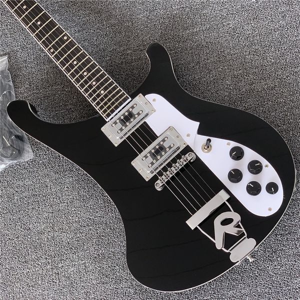 

black electric guitar with 6 strings,r tailpiece ,dots fret inlay,chrome hardware,white pickguard,5 knobs