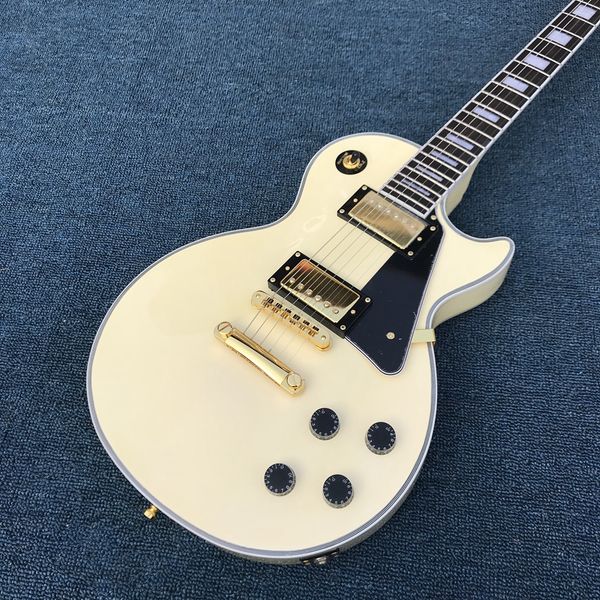 

custom electric guitar in cream color with 2 pickups, rosewood fingerboard with gold color hardware guitarra.ing